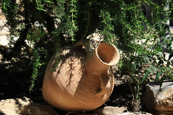 A clay jar in a traditional Lebanese garden.