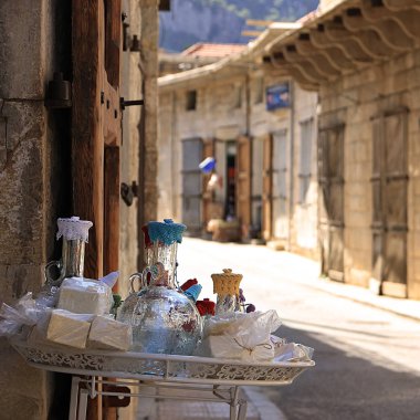 A display of glass water pitchers in the souks of Douma, Lebanon. clipart