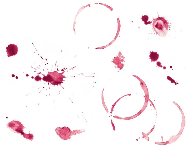 Collection of various red wine ring stains and splatters isolated on white