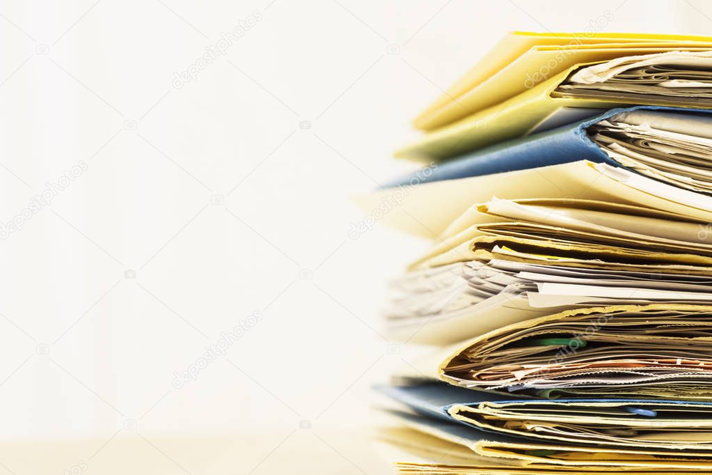 Stack of Files and Papers to Proces