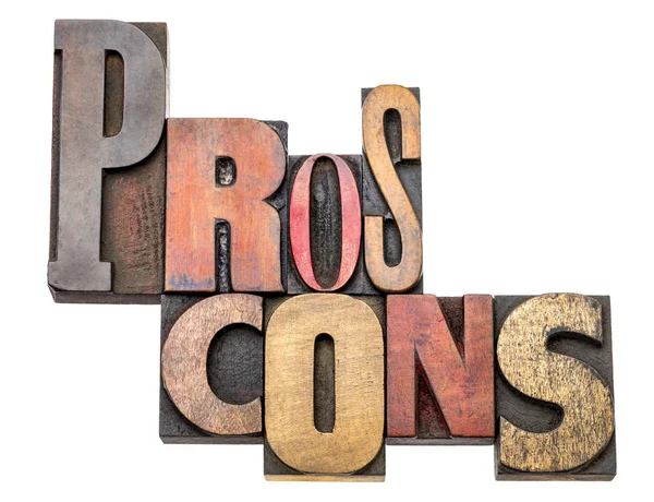 pros and cons - isolated word abstract in vintage letterpress wood type, mixed fonts - choice concept