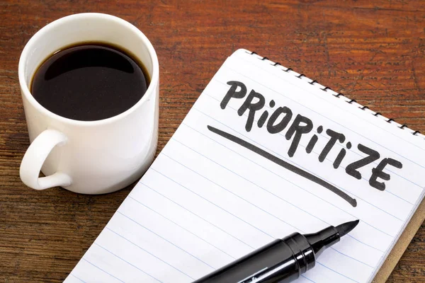 Prioritize Advice Reminder Handwriting Oin Spiral Notebook Cup Coffee — Stock Photo, Image