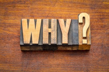 why question in vintage letterpress wood type against rustic wooden board clipart