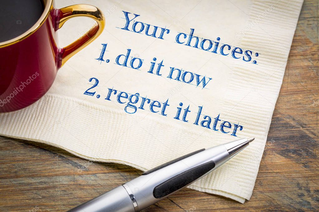 Your choices - do it now or regret it later, motivational handwriting on napkin with a cup of coffee