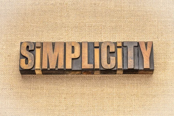 Simplicity Word Abstract Vintage Letterpress Wood Type Blocks Burlap Canvas — Stock Photo, Image