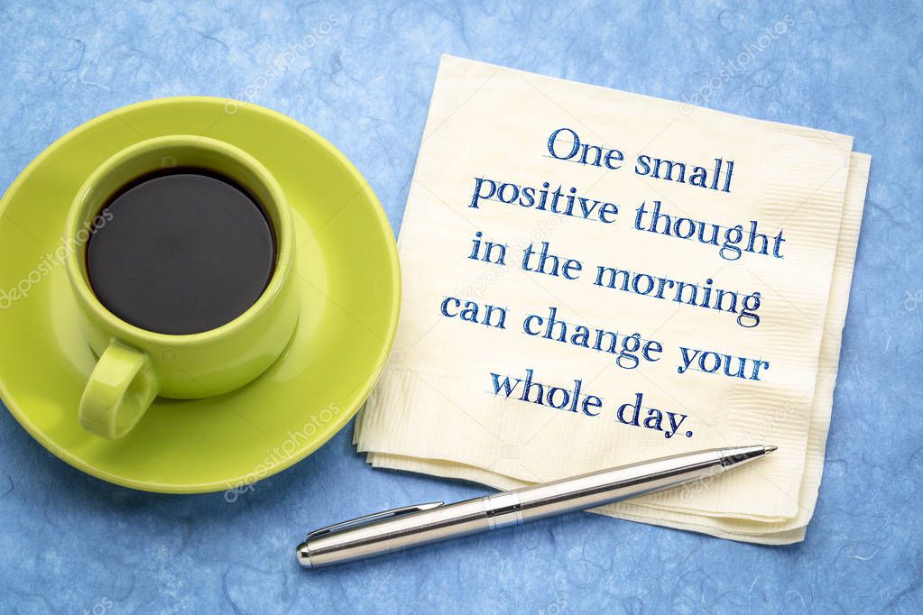 One small positive thought in the morning can change your whole day - inspirational handwriting on a napkin with a cup of coffee