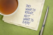 Do what is right, not what is easy  advice or reminder - handwriting on a napkin with a cup of tea