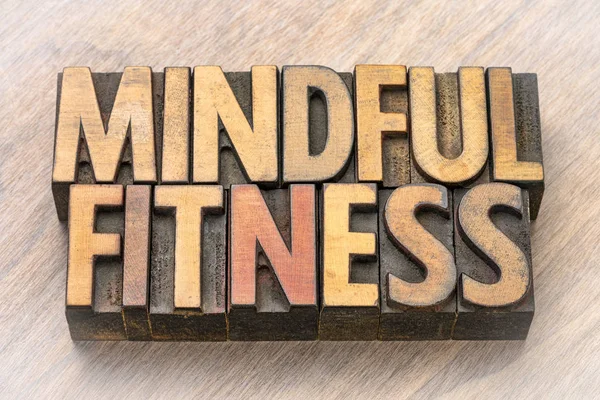mindful fitness word abstract  in vintage letterpress wood type printing blocks