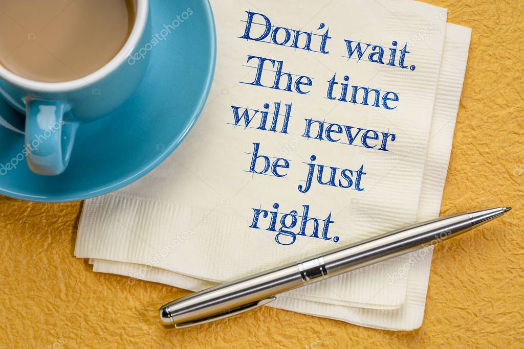 Do not wait. The time will never be just right. Handwriting on a napkin with a cup of coffee against colorful textured paper
