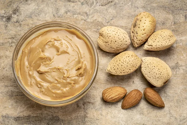 Almond butter and nuts — Stock Photo, Image