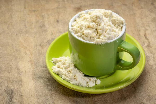 Whey protein powder in a coffee cup — Stock Photo, Image