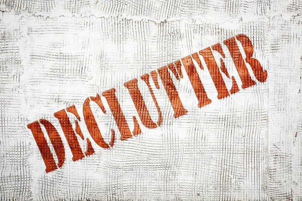 Declutter graffiti on stucco wall — Stock Photo, Image