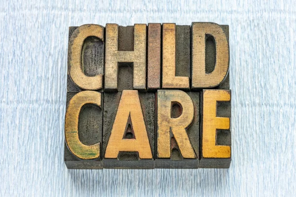 Child care text in wood type — Stock Photo, Image