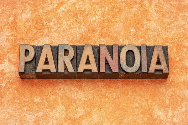 Paranoia Word abstract in houttype — Stockfoto