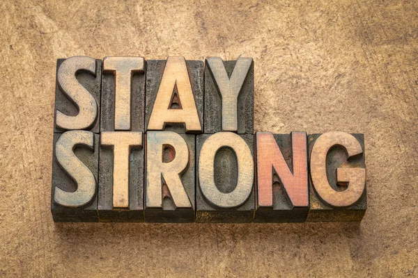 Stay strong word abstract in wood type — Stock Photo, Image