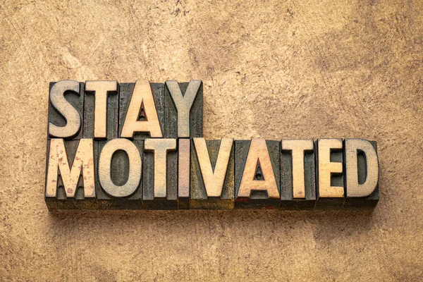 stay motivated word abstract in wood type