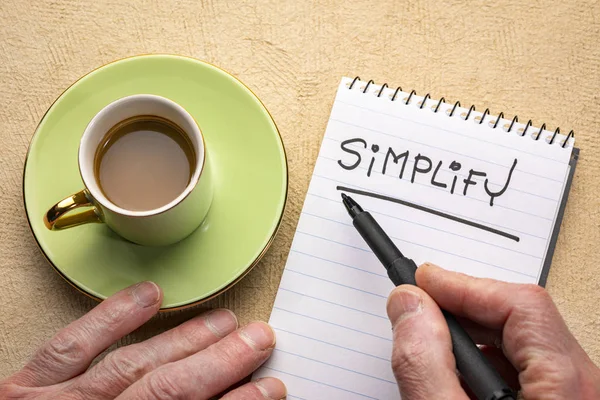 Simplifique la palabra - la escritura a mano en un cuaderno — Foto de Stock
