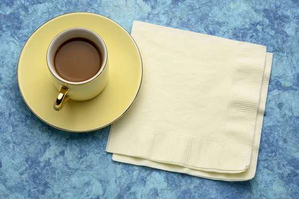 Cup of coffee with napkin — Stock Photo, Image