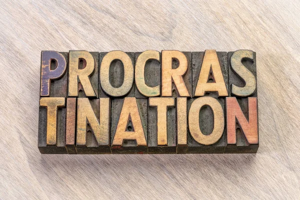 Procrastination word abstract in wood type — Stock Photo, Image