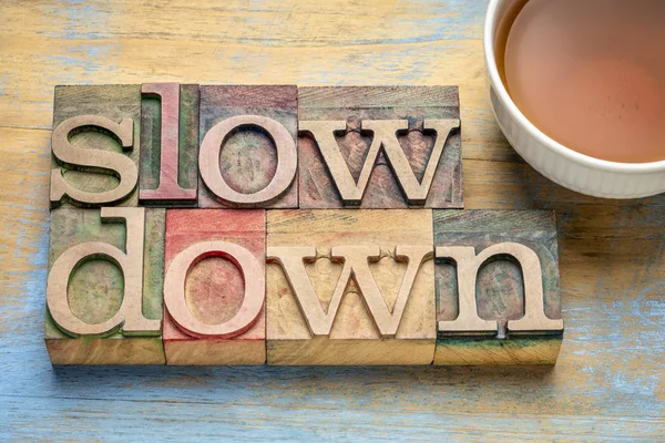 Slow down word abstract in wood type — Stock Photo, Image