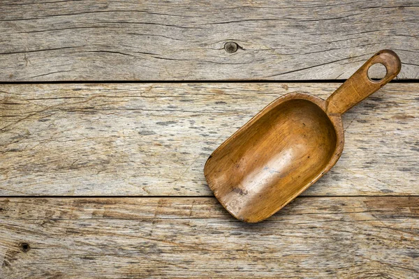 Empty rustic wooden scoop — Stock Photo, Image
