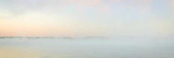 Foggy sunrise over river or lake — Stock Photo, Image