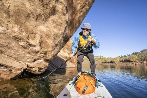 Senior male on stand up paddleboard - POV — Stock Photo, Image