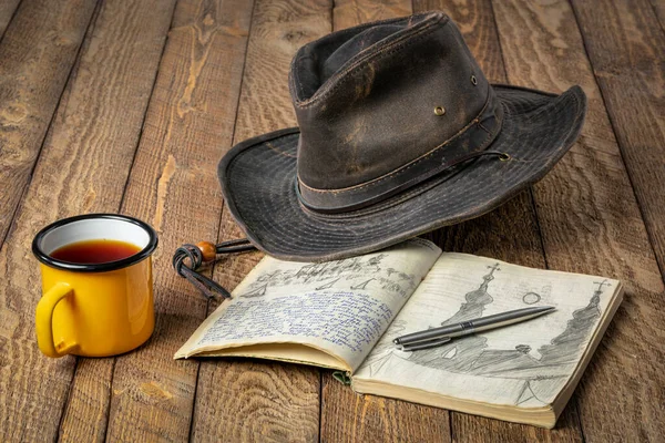 Vintage Expedition Journal Rustic Picnic Table Cup Tea Oilskin Hat — Stock Photo, Image