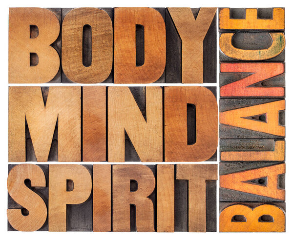 body, mind and spirit balance - a collage of isolated text in vintage wood letterpress printing blocks, holistic approach to wellbeing and lifestyle concept