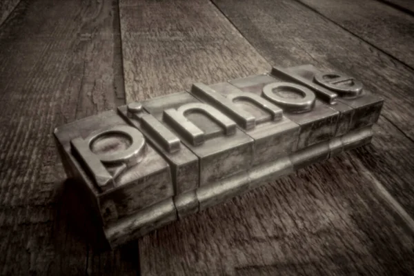 Pinhole Word Gritty Letterpress Metal Type Weathered Wood Soft Focus — Stock Photo, Image