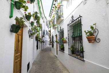 White architecture and traditional Andalusian decoration in the Villa neighborhood in the center of Priego de Cordoba in Andalucia in southern Spain clipart