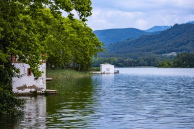 Landscape of Lake Banolas (Banyoles in the Catalan language) in the province of Gerona in the autonomous community of Catalonia in Spain Europe clipart