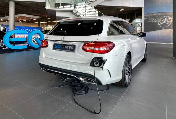 The Mercedes-Benz hybrid car C300e with electric and combustion engine as part of the EQ Power line is presented in the Mercedes Benz showroom at the headquarter of the company in Stuttgart, Germany. — Stock Photo, Image