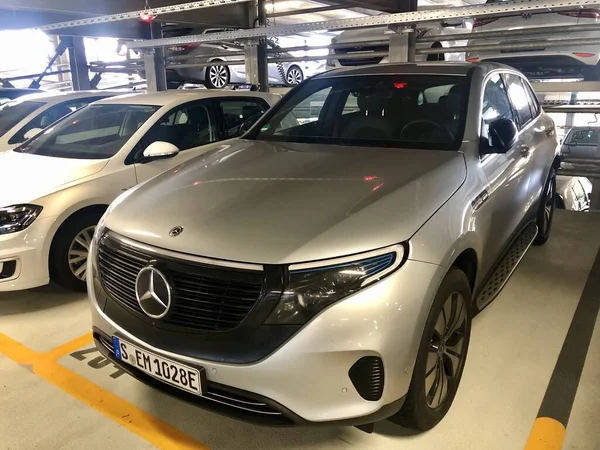 A silver Mercedes-Benz EQC 1886 special edition car is parked in a parking garage in Stuttgart — Stock Photo, Image