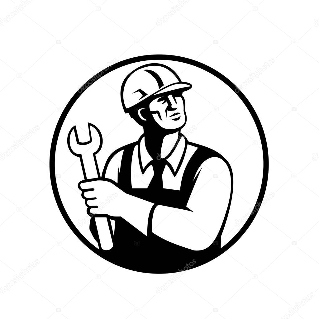 Retro black and white style illustration of a repairman or handyman holding a spanner looking up set inside circle on isolated background.