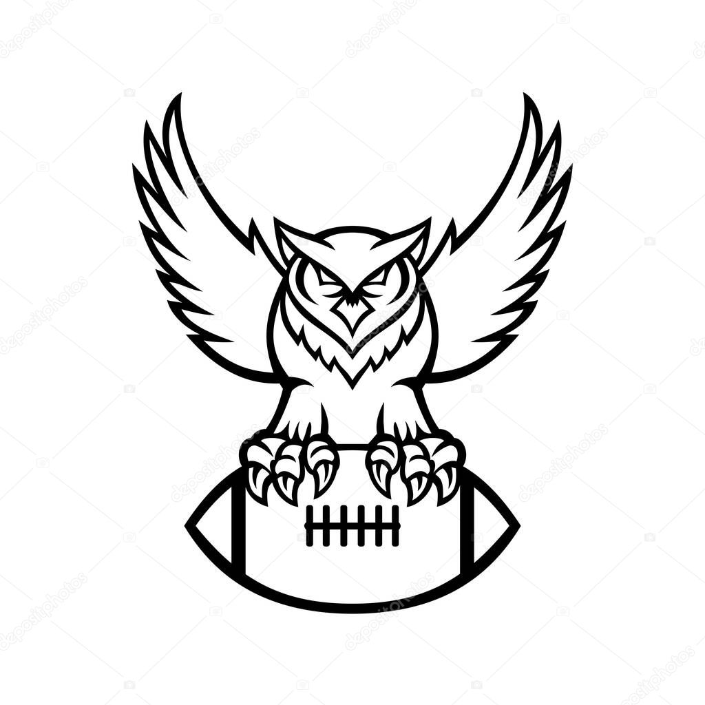 Mascot illustration of a great horned owl, tiger owl or hoot owl, a large owl native to the Americas, clutching an American football ball viewed from front in retro black and white style.