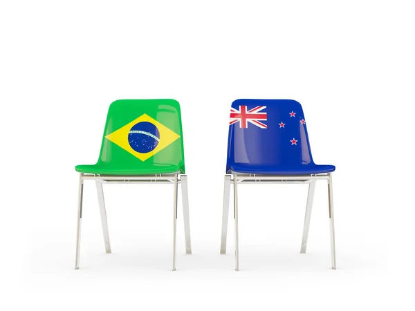 ブラジル、ニュージーランドの国旗と 2 つの椅子 — ストック写真