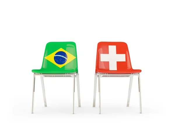 Brezilya ve İsviçre bayrakları taşıyan iki sandalye — Stok fotoğraf