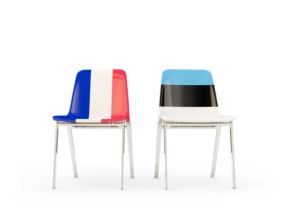 Duas cadeiras com bandeiras de França e estonia — Fotografia de Stock
