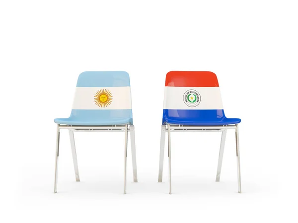 Dos sillas con banderas de Argentina y paraguay — Foto de Stock