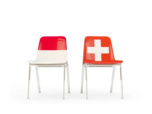 Duas cadeiras com bandeiras da Indonésia e Suíça — Fotografia de Stock