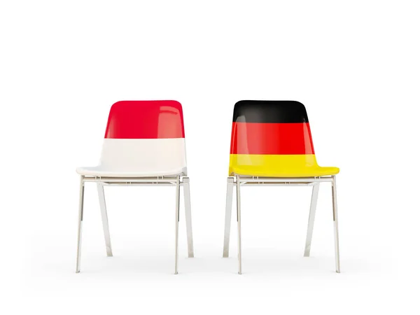 Dvě židle s příznaky Indonésie a Německo — Stock fotografie