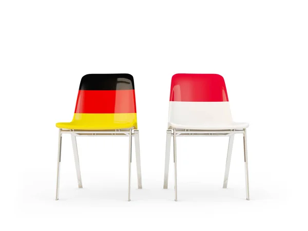 ドイツ、インドネシアの国旗と 2 つの椅子 — ストック写真