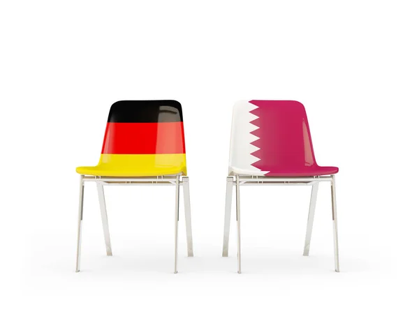 Dvě židle s vlajkami Německa a Katar — Stock fotografie