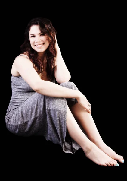 Young Caucasian Woman Brown Hair Sitting Gray Dress Black Background — Stock Photo, Image