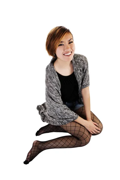 Young Asian American Woman Sitting On White Background — Stock Photo, Image