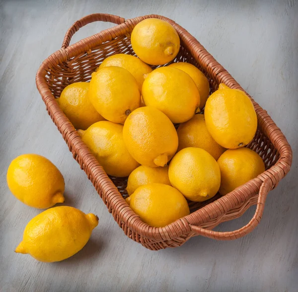 Basket Lemons Gray Wooden Table — Stock Photo, Image