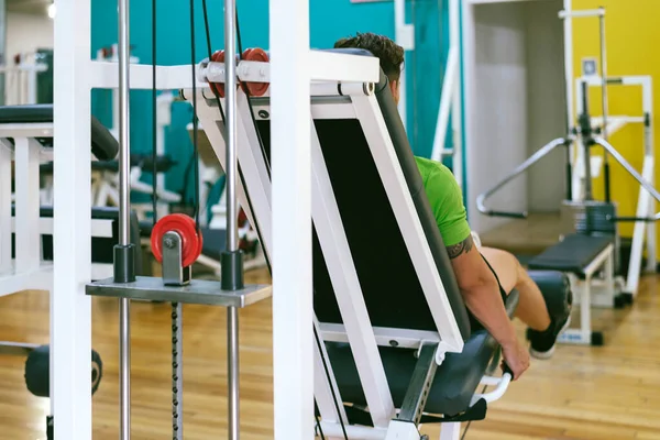 Young Sportsman Almost Shouting Doing Leg Extension Heavy Weight — Stock Photo, Image