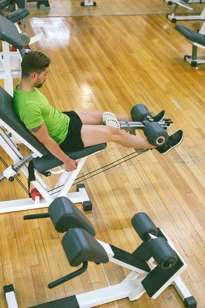 Young Sportsman Almost Shouting Doing Leg Extension Heavy Weight — Stock Photo, Image