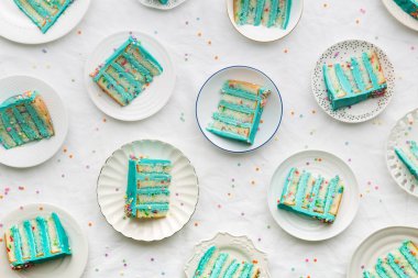 Slices of birthday layer cake overhead view clipart